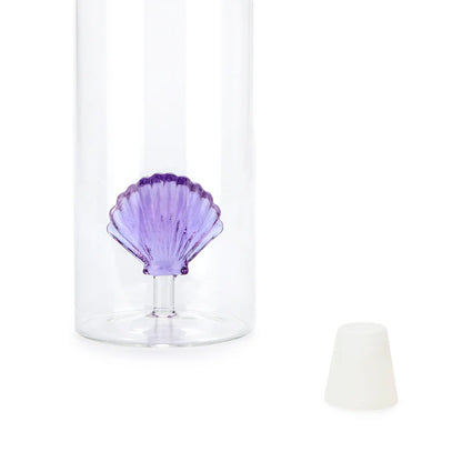 Atlantis Shell bottle, close-up on the purple shell at the base